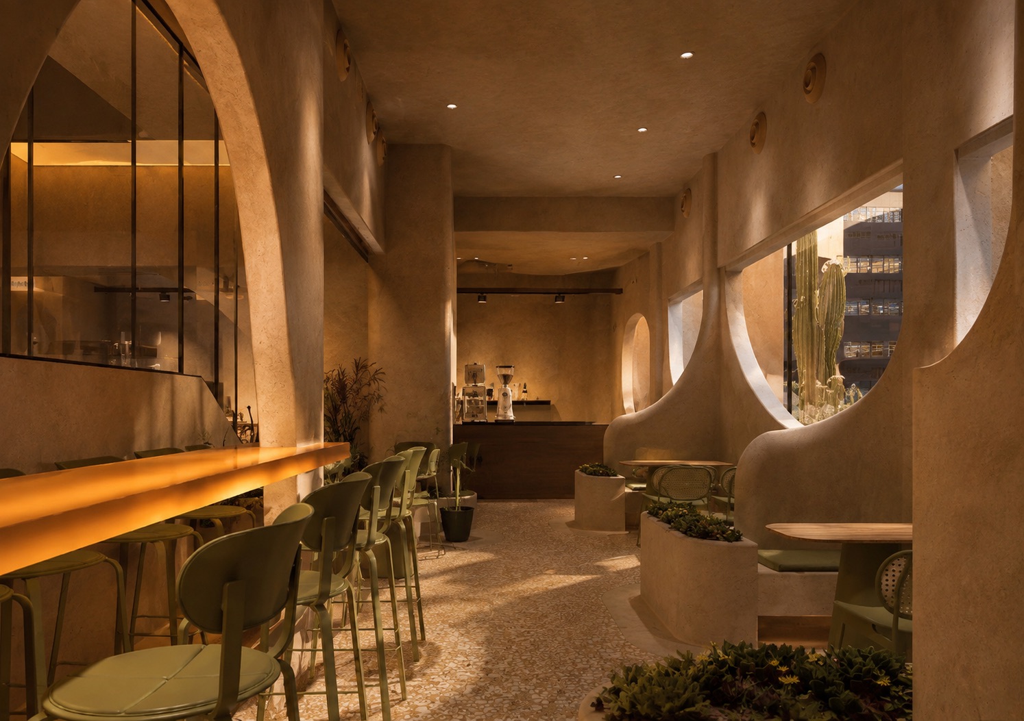 Curved window openings pouring light over the bar rail
